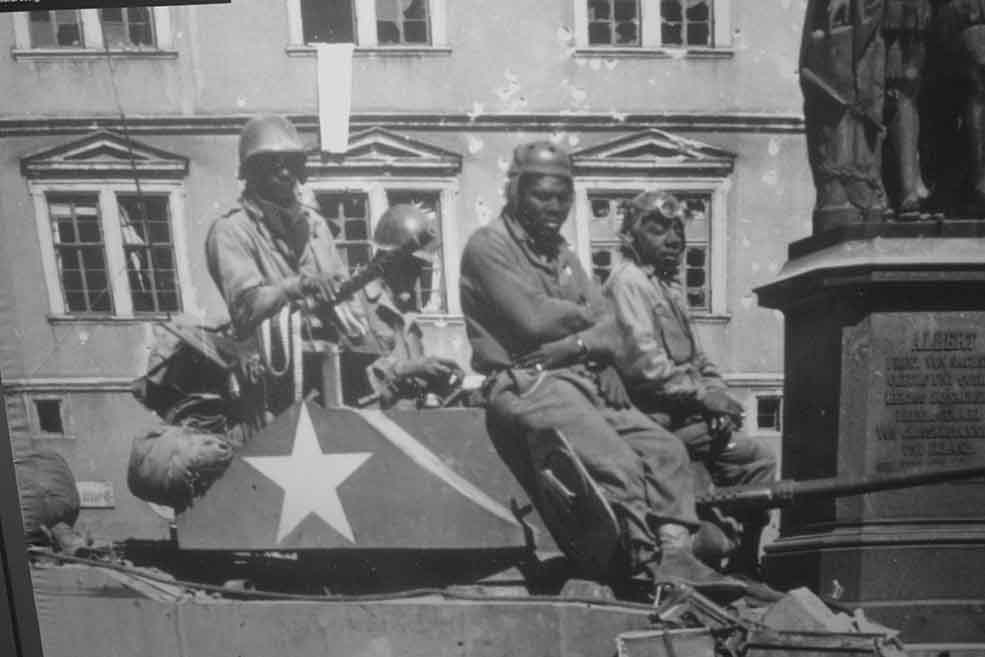 Members of an African-American tank battalion prepare to clear out enemy positions in Coburg, Germany, in April 1945. The 761st Tank Battalion saw 183 consecutive days of combat while attached to General George Patton’s Third Army.