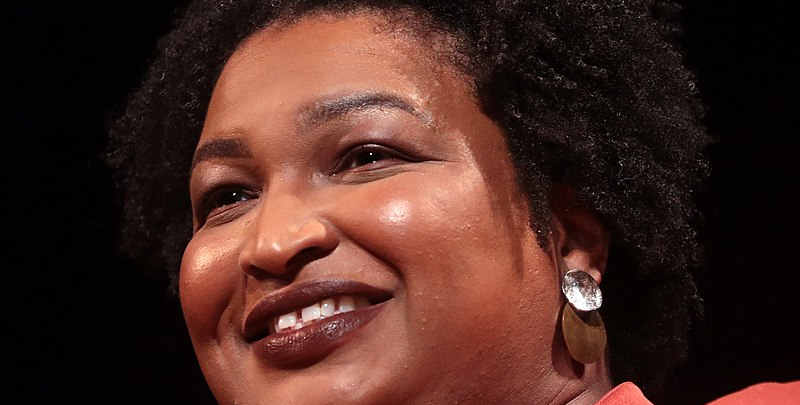 Stacey_Abrams_by_Gage_Skidmore-7bvl79txl1n0klskf18s9l2gcx1j2thfe5l8buszz44.png